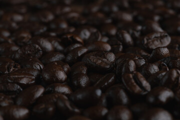 Roasted coffee bean on wooden table..