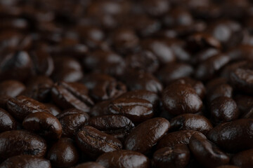 Roasted coffee bean on wooden table..