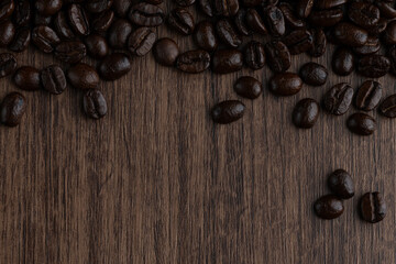 Roasted coffee bean on wooden table..