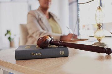 Gavel, law firm and books on table of attorney in office for judge, justice and court trial....