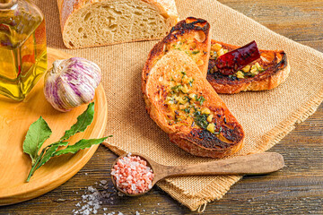 Mediterranean Still Life with Traditional Flavor: Bread, Garlic and Oil
