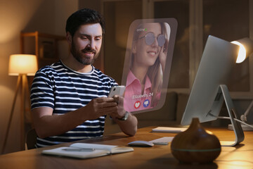 Smiling man looking for partner via dating site indoors. Profile photo of woman, information and...