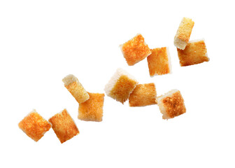 Delicious crispy croutons flying on white background