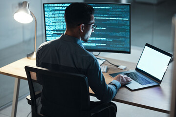 Man, night and coding in office, computer or blank screen for mockup space with html, programming or web design. Tech expert, information technology or developer with typing, laptop or dark workplace - obrazy, fototapety, plakaty