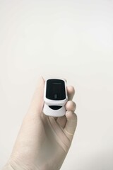 Close up of human finger while using Pulse Oximetry isolated on white background.