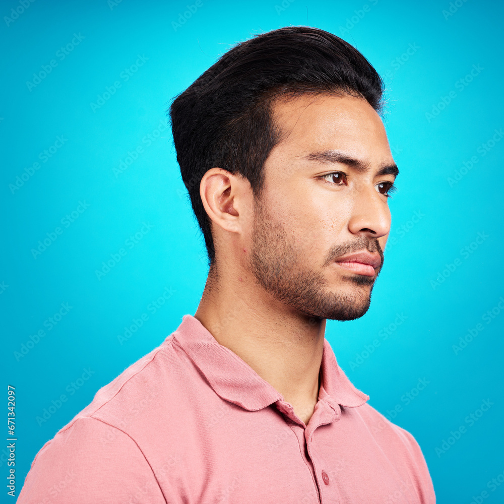 Aufkleber thinking, serious and profile of asian man in studio isolated on a blue background. idea, side face 