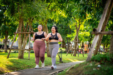 An obese woman who turns to exercise to take care of her health and lose weight on lawn in a fun way