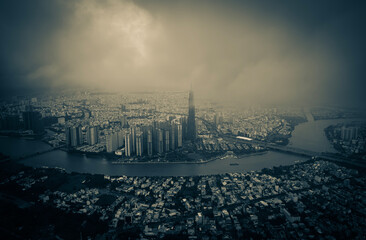 Ho Chi Minh City skyline moody and dramatic aerial view in storm in black and white
