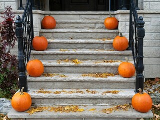 Front steps of house with pumpkins for fall decorations