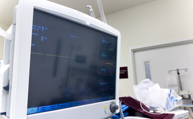 hospital monitor displaying vital signs: blood pressure, heart rate, pulse oximetry, and temperature, providing critical patient health data in a medical setting