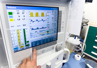 Obraz na płótnie Canvas hospital monitor displaying vital signs: blood pressure, heart rate, pulse oximetry, and temperature, providing critical patient health data in a medical setting