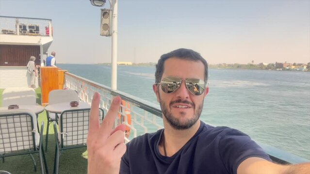 Happy tourist on cruise ship recording selfie with joy on vacations. Travel