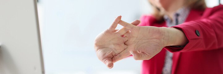 Satisfied manager stretches arms after monotonous paperwork