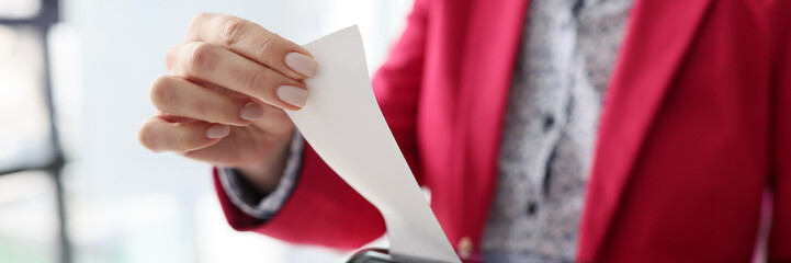Administrator tears off purchase receipt after e-payment