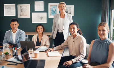 Portrait, group of business people at desk with smile and confidence at meeting for employees in office. Teamwork, about us and leadership, senior lawyer with happy legal team at advisory law firm. - obrazy, fototapety, plakaty