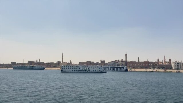 CRUISE SHIPS DOCKING IN NILO RIVER PORT OF EGYPTIAN CITY IN EGYPT