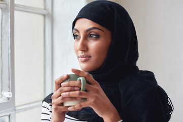 Window, thinking and Islamic woman with coffee, peace and calm in home, daydreaming and thoughts....