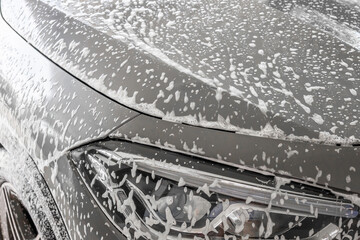 Obraz premium car cleaning and washing with foam soap