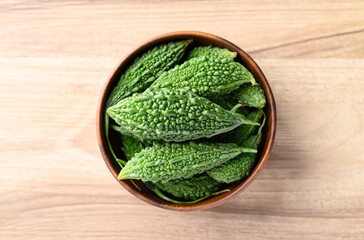 Bitter gourd or bitter melon in bowl, Asian food ingredients and herbal medicine
