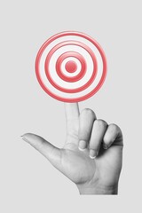 Businessman hand holding a colored target.