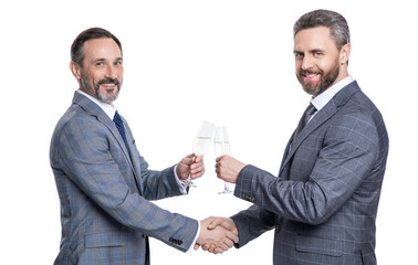 partnership concept. celebrate business deal. two businessmen handshaking after contract deal with champagne. successful agreement in business deal. businessmen dealing isolated on white. cheers