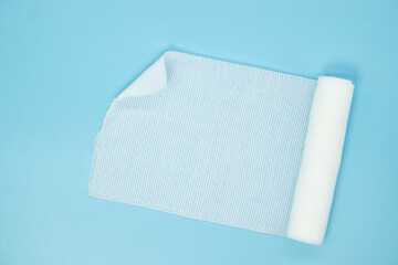 comfortable elastic bandage on blue background