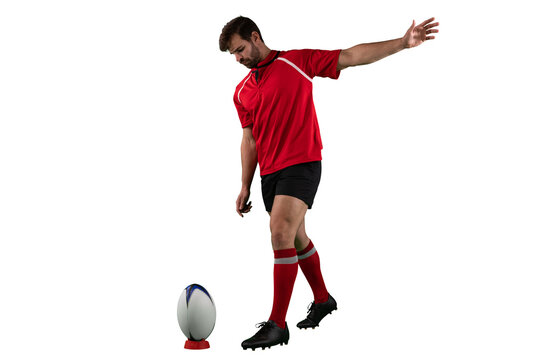 Digital png photo of caucasian male rugby player kicking ball on transparent background