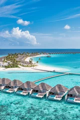Poster Picturesque aerial landscape luxury tropical island resort with water villas. Beautiful island beach palm trees, sunny sea sky. Amazing bird eyes view in Maldives paradise coast. Exotic best vacations © icemanphotos