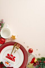 Obraz na płótnie Canvas Playful New Year's Table for Kids: vertical top view of snowman cutlery pocket, festive plates, mug, baubles and more, set against a pastel beige background with space for text or advertisements