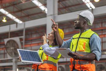 Factory metal workers install solar panels, cut costs, earn carbon credits, combat climate change.