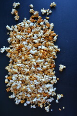 Striped box with popcorn on red background