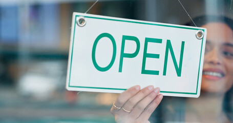 Happy woman, small business or open sign on window in coffee shop or restaurant ready for service....