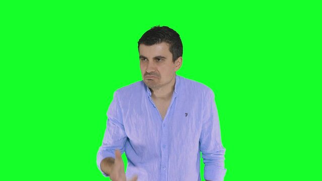 man with confused expression on green screen background, hand gesture; I don't understand.