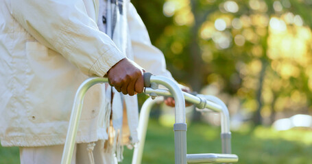 Hands, walking frame and a senior person in a garden outdoor in summer closeup during retirement. Wellness, rehabilitation or recovery and an elderly adult with a disability in the park for peace - obrazy, fototapety, plakaty