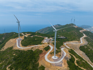 A field of solar panels and wind turbines in Quy Nhon, Binh Dinh, Vietnam