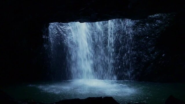 Static shot of Natural Bridge at Springbrook National Park in Queensland Australia. Waterfall