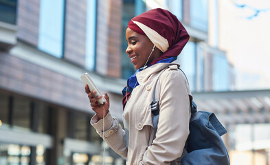 Social media, music and Muslim woman with a phone in the city for 5g connection, internet and chat. Communication, streaming and Islamic girl typing and reading on a mobile with a podcast in town