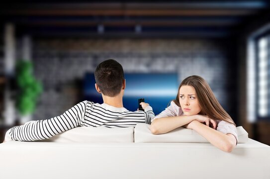 Young cad couple On Couch At Home, Conflicts And Problems, AI generated image