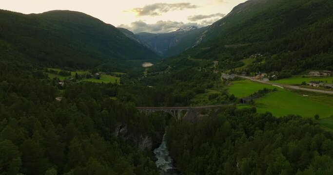 Iconic Kylling stone railway bridge over Rauma river, Romsdalen Valley. Aerial