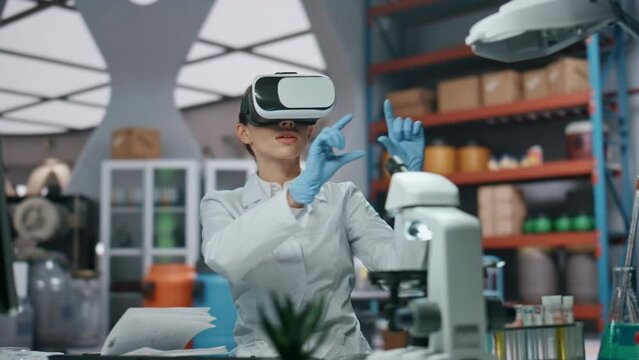 Goggles scientist working virtual reality technology in laboratory close up.