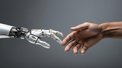 Technology and humanity to harmoniously coexist. Connection between a human hand and a robotic hand. Fusion between man and machine. The future of technology.