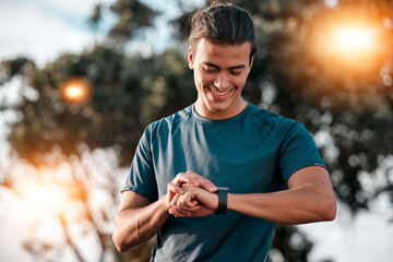 Smart watch, man and fitness at park for exercise workout, training and happy goals. Stopwatch, sports person and runner check time, heart rate or monitor healthy body progress, data app and wellness - obrazy, fototapety, plakaty