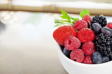 Colorful tasty fresh berry Salad in bowl