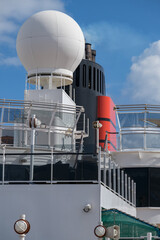 Red and black funnel of classic ocean liner cruise ship cruiseship Elizabeth or Victoria against...