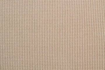 Knitted wool texture background, cozy and warm fabric patterned surface, soft and fuzzy and gray backdrop.