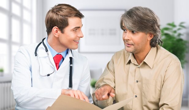 Happy doctor with a man patient for healthcare treatment, AI generated image
