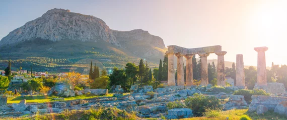 Foto auf Acrylglas Anbetungsstätte Ruins of temple of Apollo at sunset, Ancient Corinth in Greece