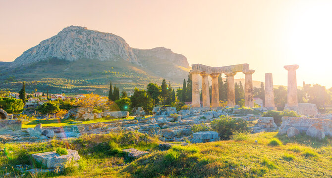 Ruins of temple of Apollo at sunset, Ancient Corinth in Greece