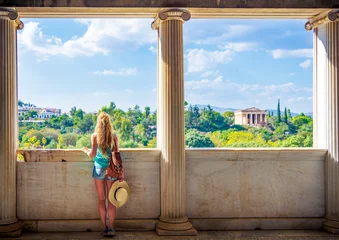Fotobehang Woman tourist looking at Temple of Hephaestus, Athens in Greece- Ancient Agora © M.studio