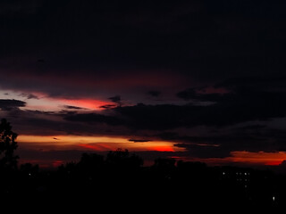 Obraz premium time lapse sunset, scenery view of dark clouds in sky background, nature photography, natural outdoor scene, dawn wallpaper